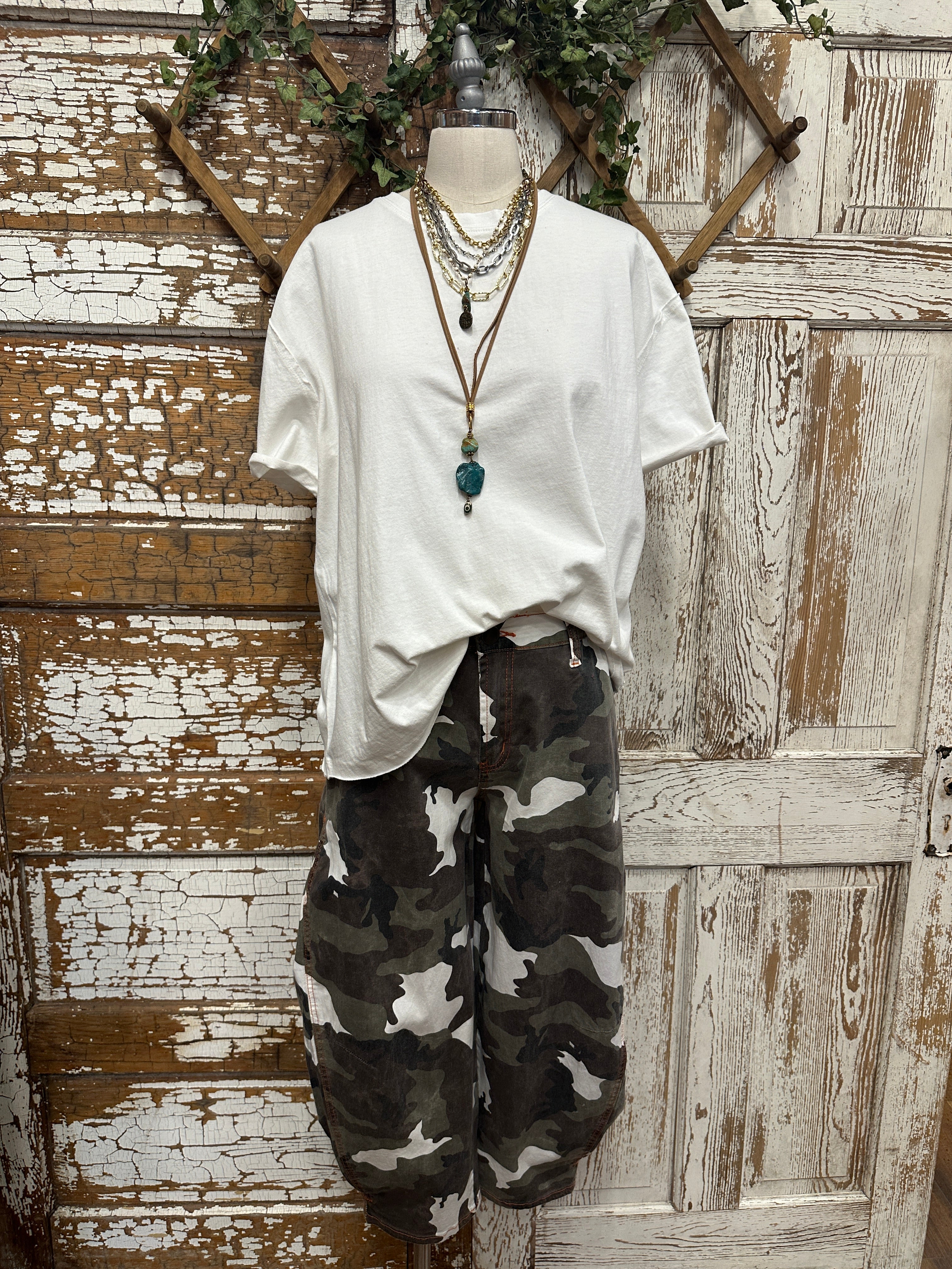 boutiques near me featuring white tee with camo pants and handmade jewelry
