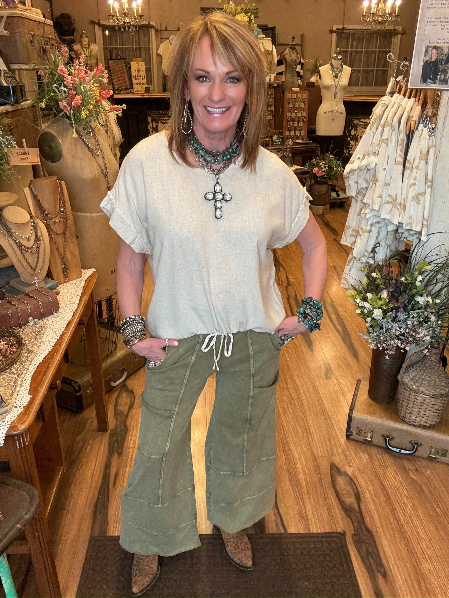 Lu standing in Leavenworth, KS boutique in new boutique clothing arrivals