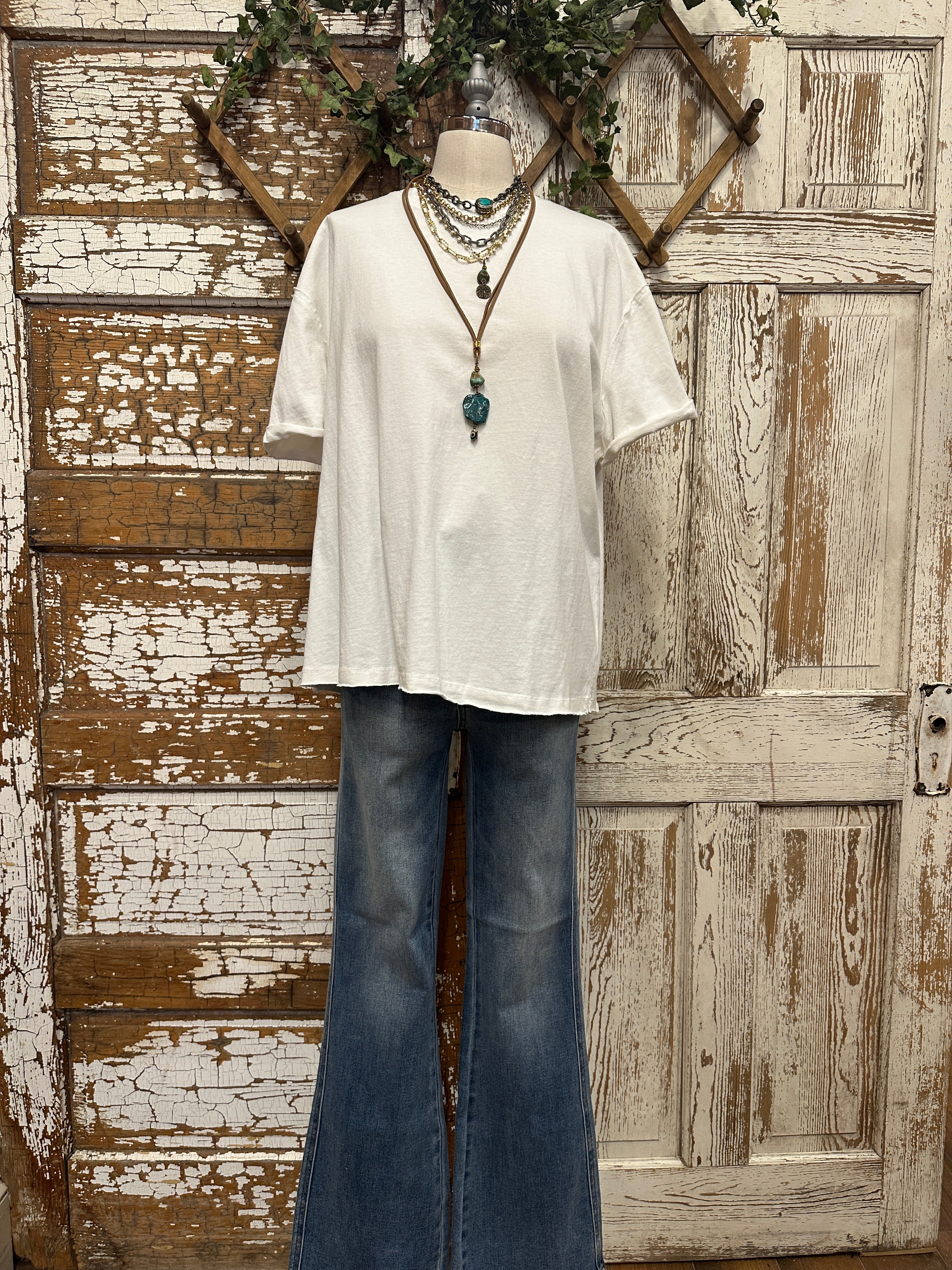 boutiques near me featuring white tee with jean pants and handmade jewelry
