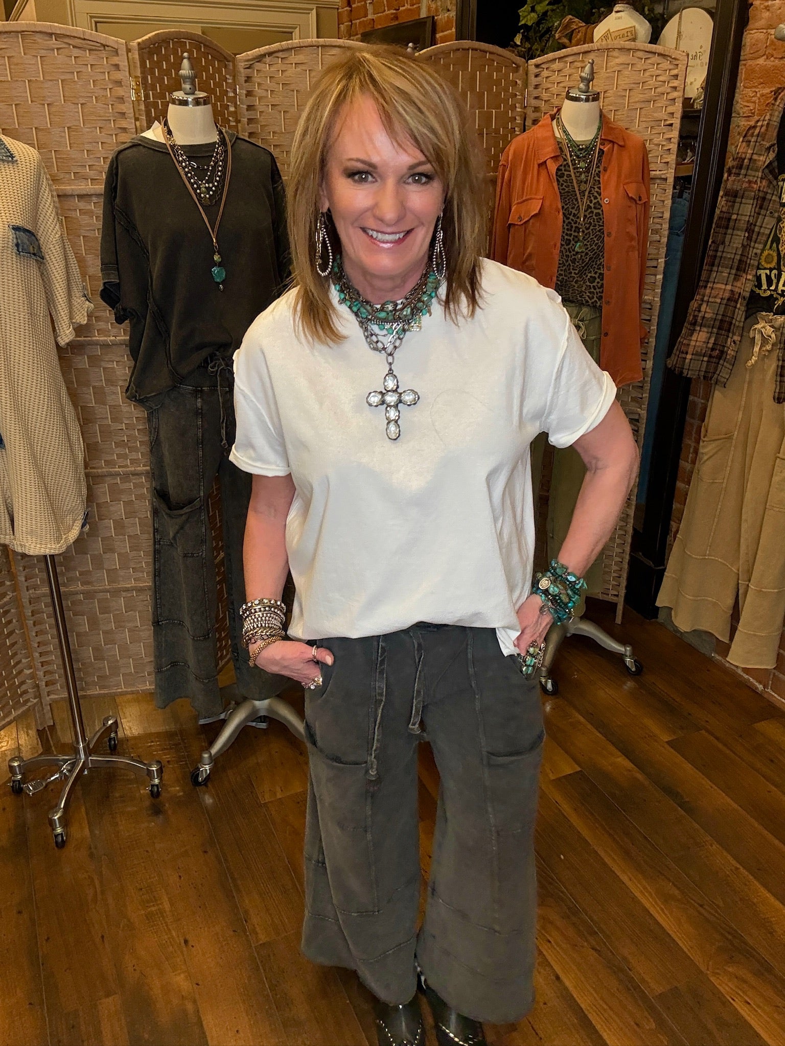 Lu standing in Leavenworth, KS boutique in new boutique clothing arrivals and handmade jewelry