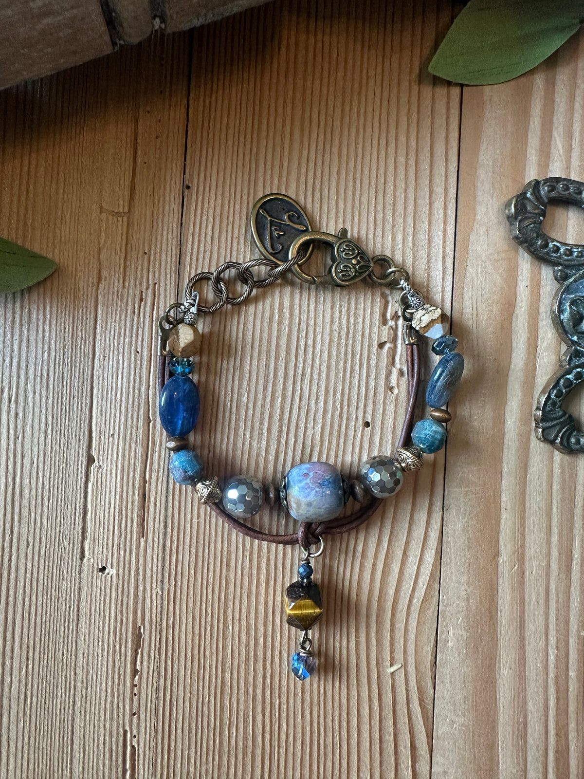 Beaded leather bracelet with blue stone beads and heart clasp