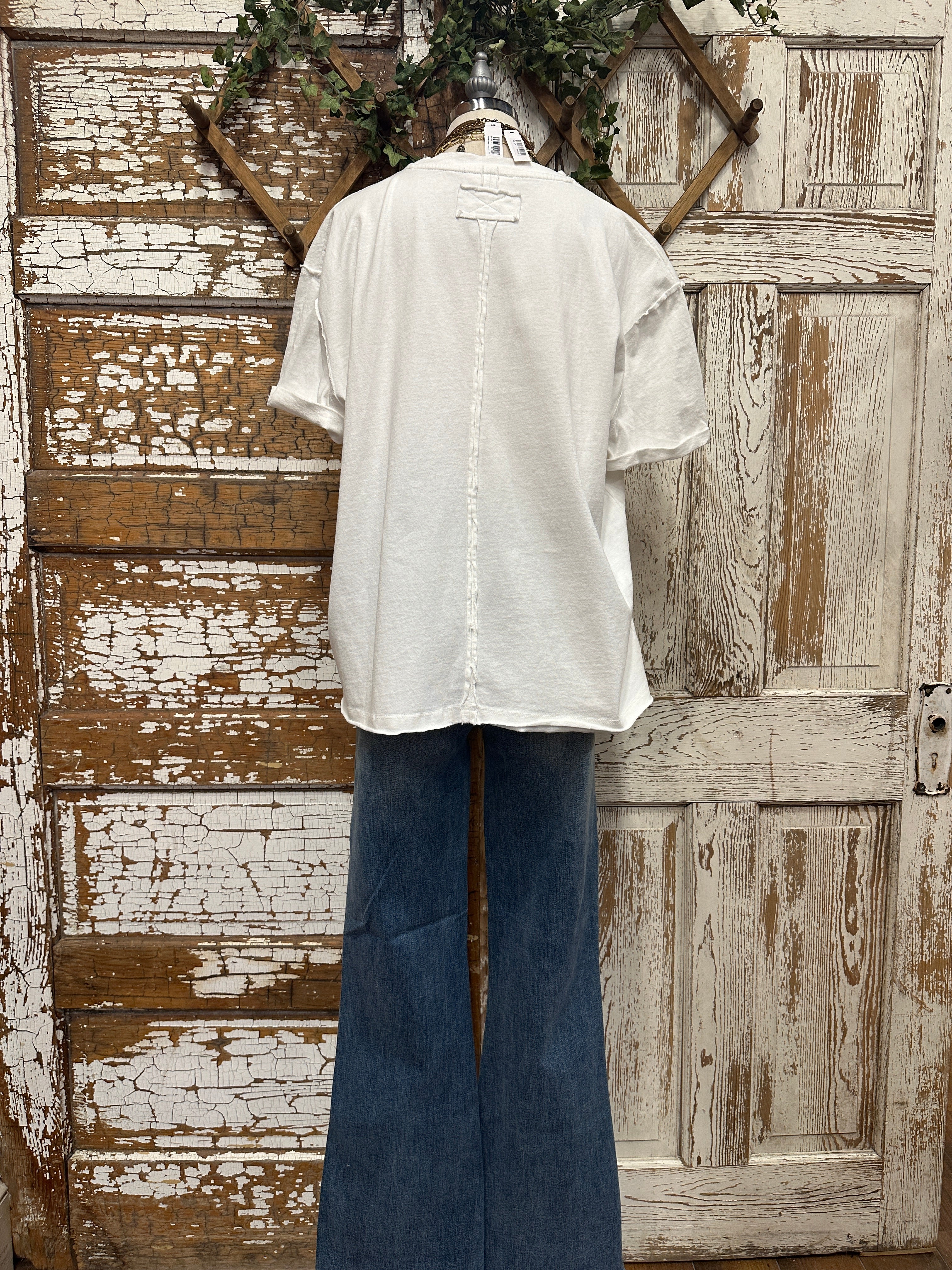 boutiques near me featuring white tee with jean pants and handmade jewelry