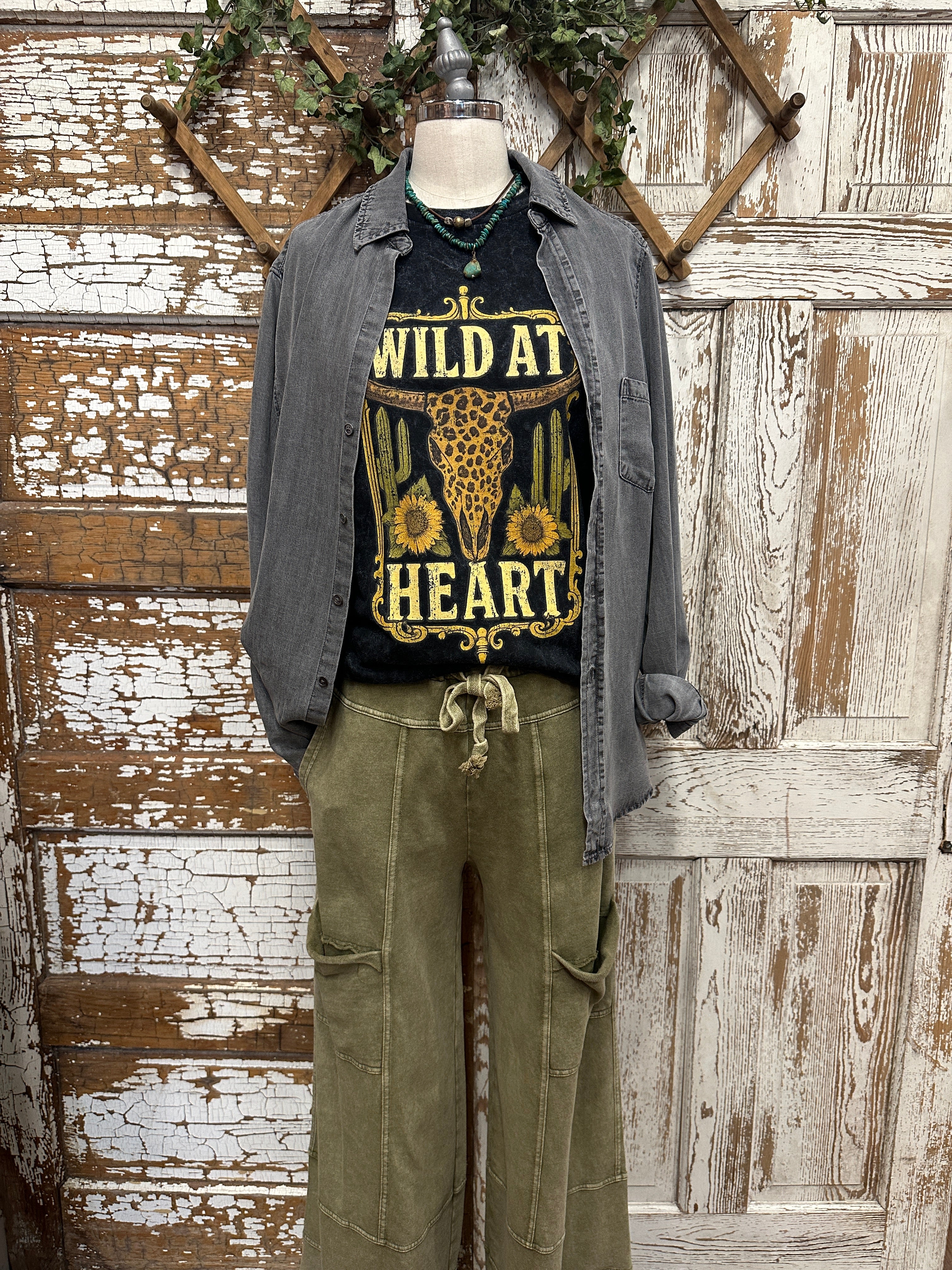 Weathered distressed button up with graphic tee and handmade jewelry and boutique clothing in boutiques near me