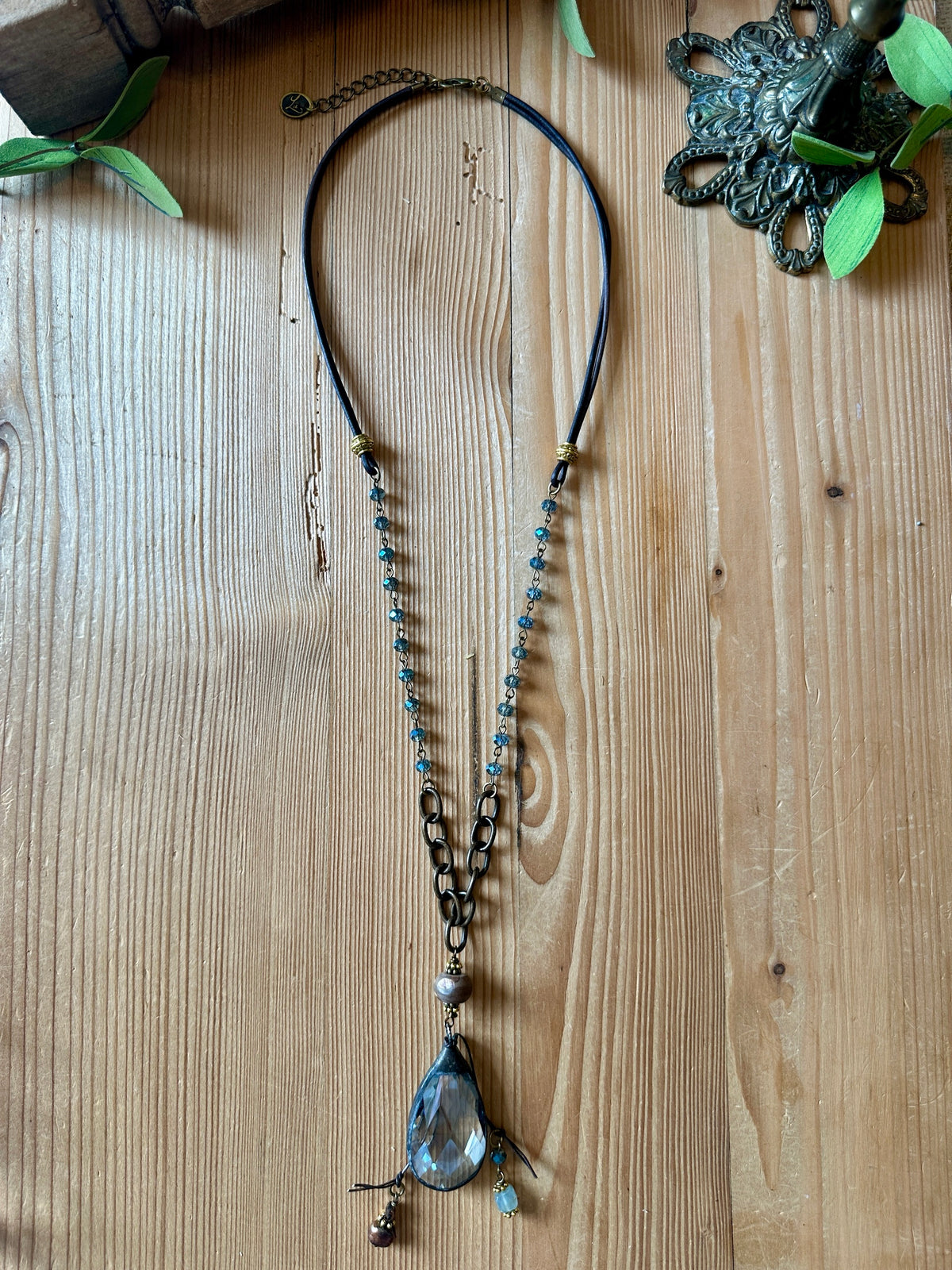 Long crystal teardrop pendant necklace with blue beaded chain