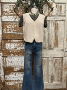 Mannequin wearing a boutique clothing vest and leopard shirt and pants with handmade jewelry in Leavenworth, KS boutique