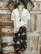 boutiques near me featuring white tee with camo pants and handmade jewelry 