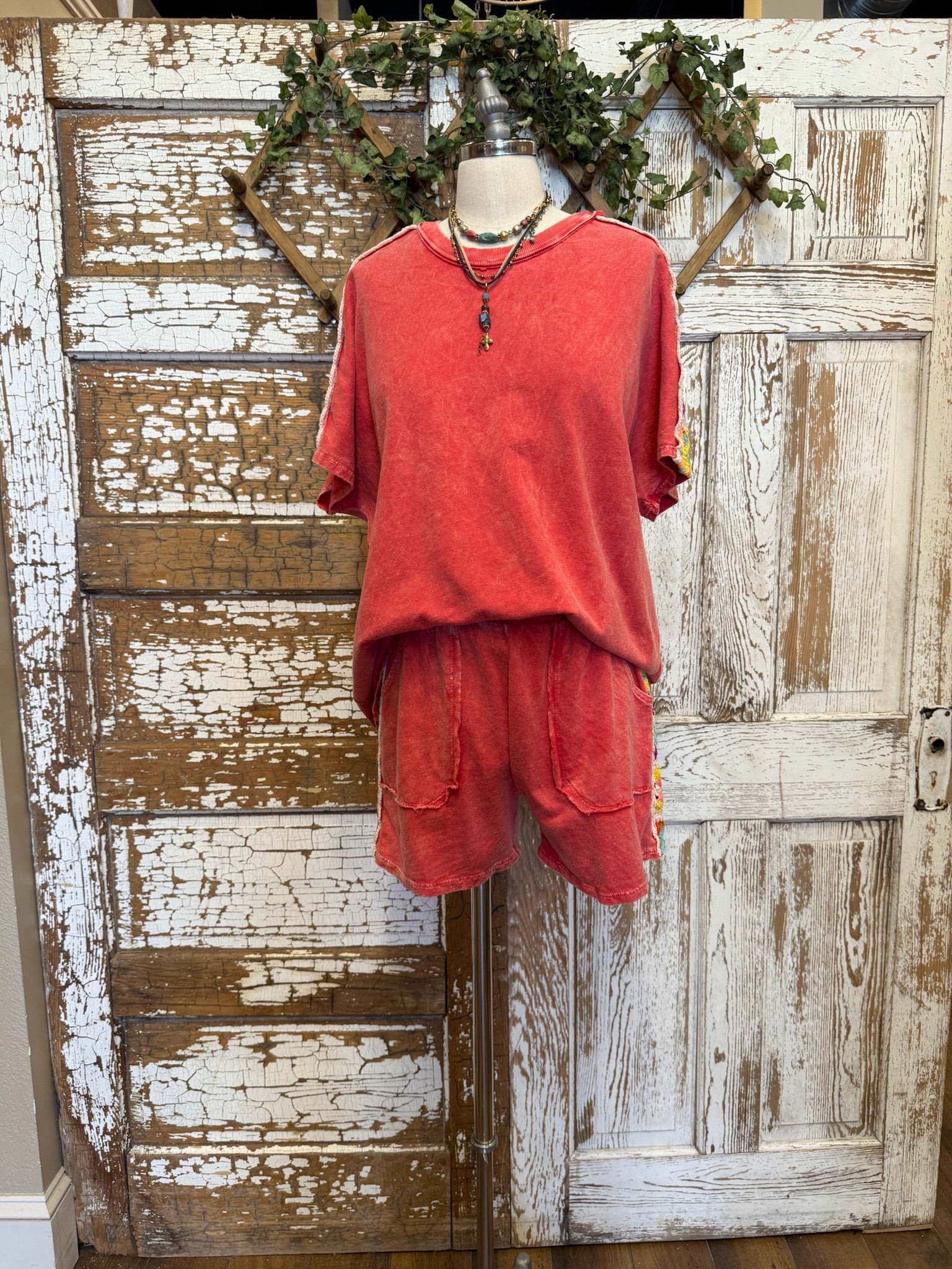 Mannequin wearing a poppy red matching leisure set in Leavenworth, KS boutique 