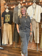 Jennifer standing in Leavenworth, KS boutique in new boutique clothing arrivals and handmade jewelry 