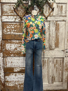 Boutique clothing featuring floral sheer layering top with handmade jewelry