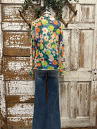 Boutique clothing featuring floral sheer layering top with handmade jewelry