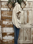Mannequin wearing a boutique clothing top and jean pants with handmade jewelry designs in boutique near me 