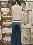 Mannequin wearing a boutique clothing vest white shirt and pants with handmade jewelry in Leavenworth, KS boutique