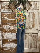 Boutique clothing featuring floral sheer layering top with handmade jewelry