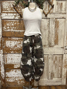 Mannequin wearing army cargo pants and white tank with handmade jewelry necklace in Leavenworth, KS boutique