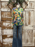 Boutique clothing featuring floral sheer layering top with handmade jewelry
