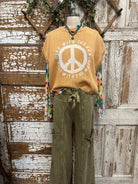 Mannequin wearing peace sign graphic tee in Springfield, MO boutique with handmade jewelry necklace