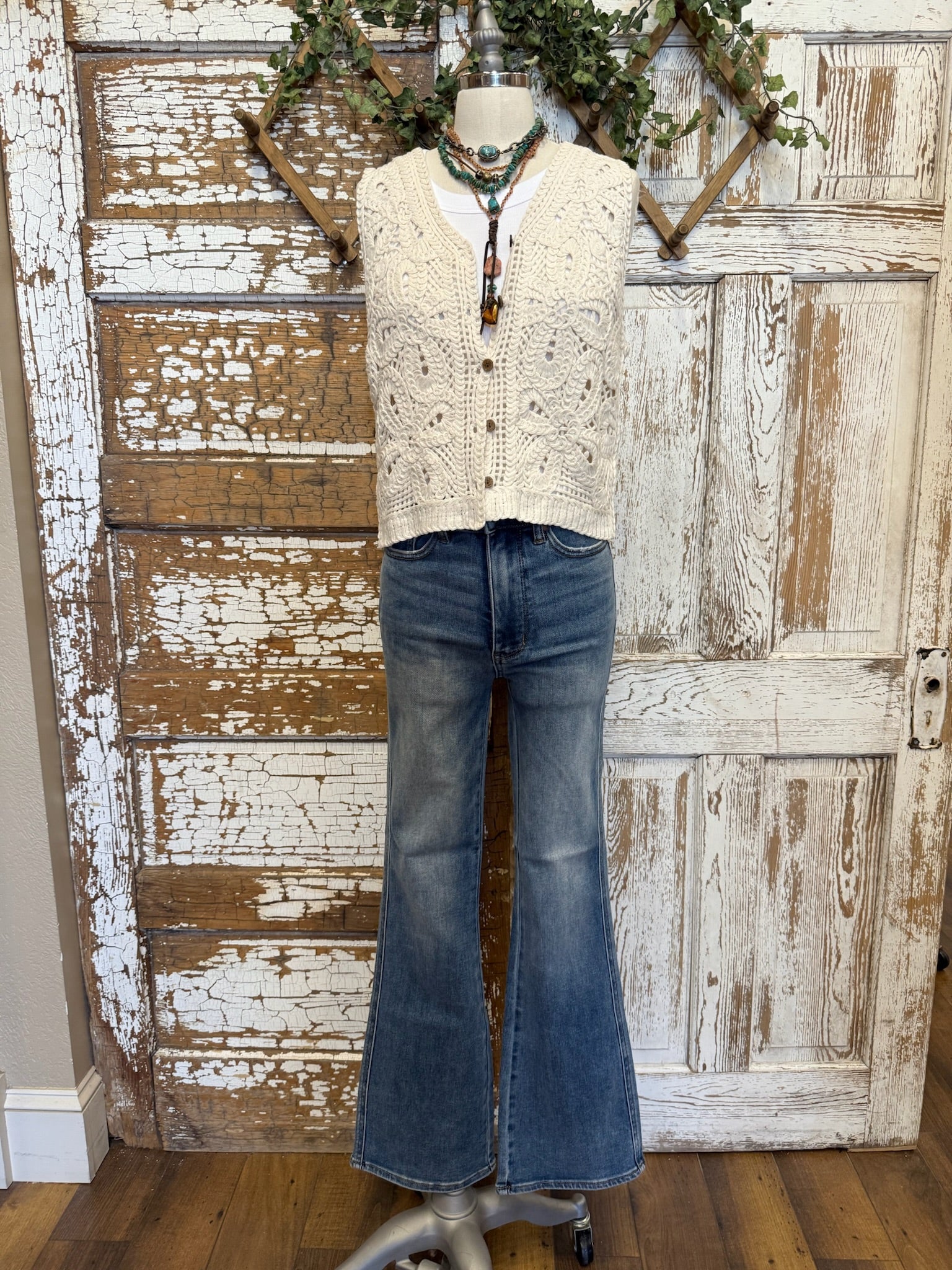 Mannequin in Leavenworth boutique store in leisurewear pants and crochet vest with handmade jewelry 