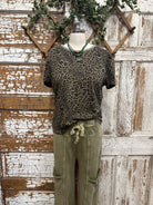 Mannequin wearing a leopard print top and leisurewear pants and handmade jewelry in Leavenworth, KS boutique