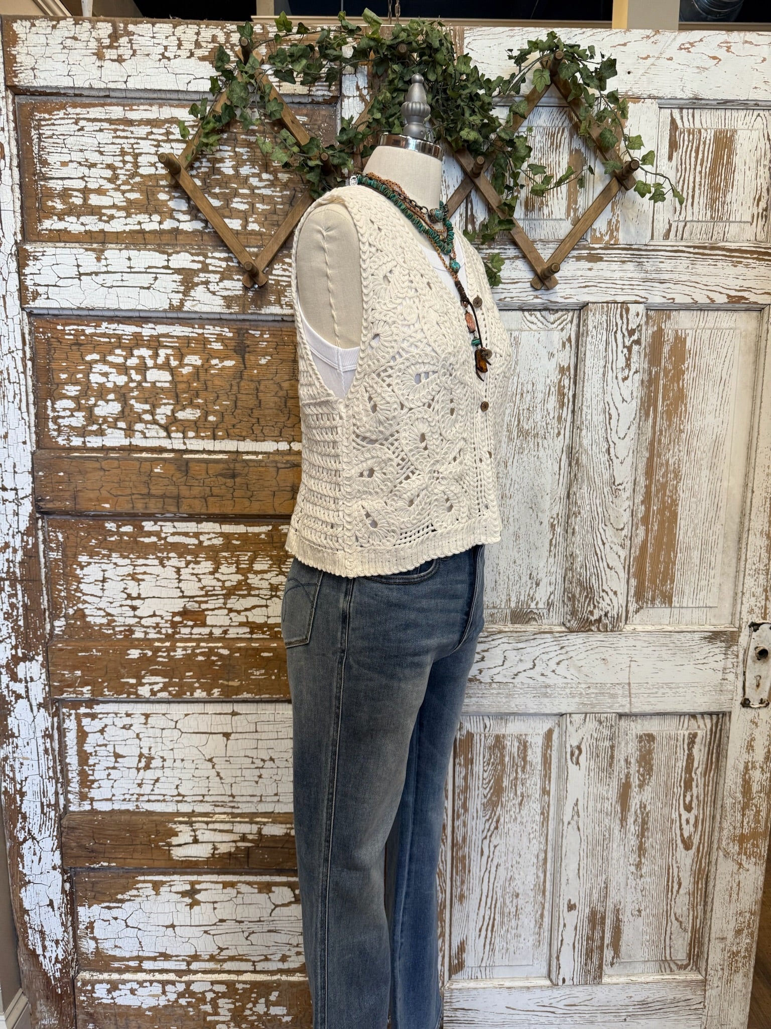 Mannequin in Leavenworth boutique store in leisurewear pants and crochet vest with handmade jewelry 