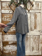 Weathered distressed button up with handmade jewelry and boutique clothing in boutiques near me