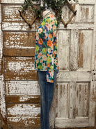 Boutique clothing featuring floral sheer layering top with handmade jewelry