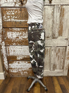 Mannequin wearing army cargo pants and white tank with handmade jewelry necklace in Leavenworth, KS boutique