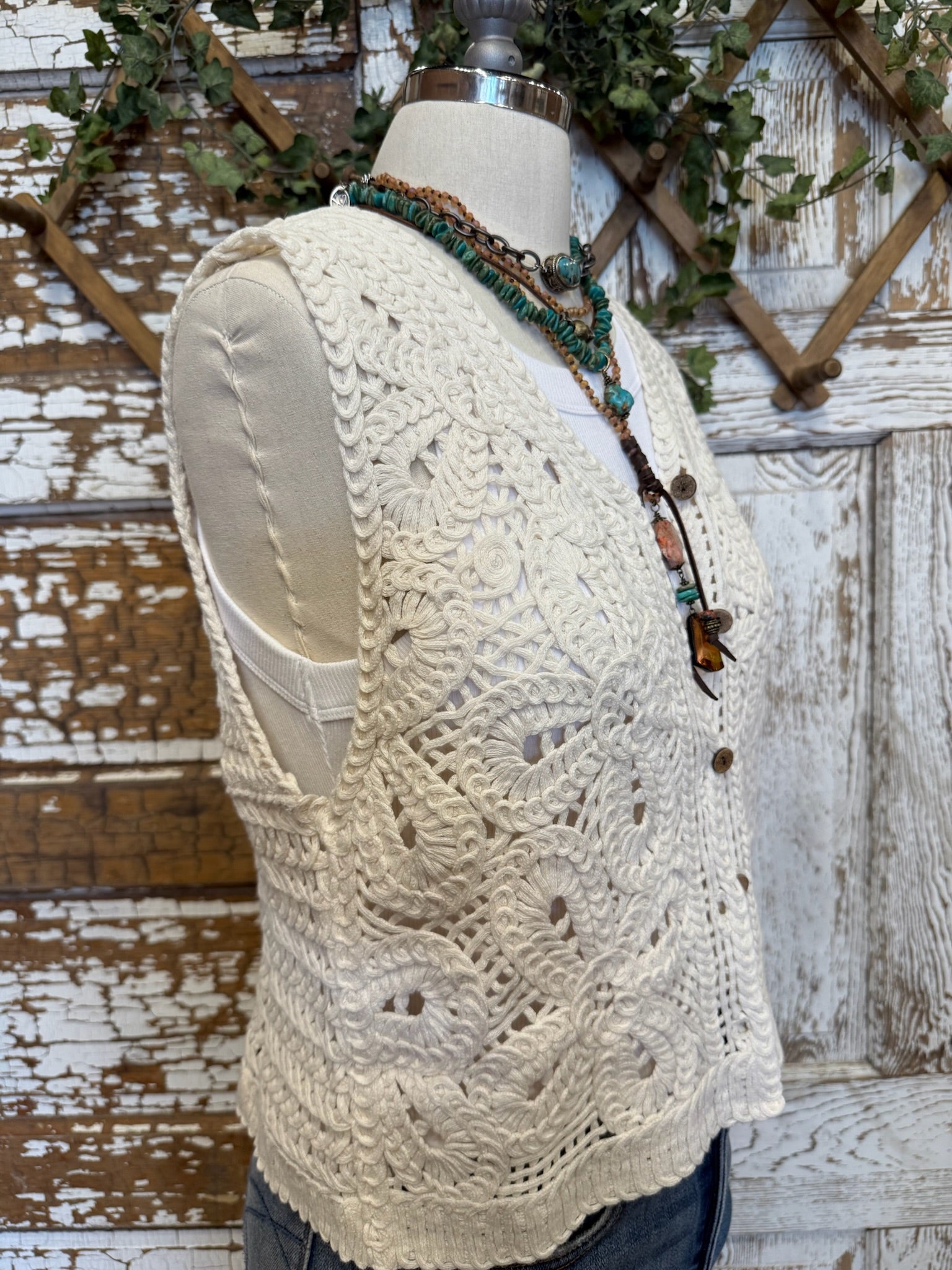 Mannequin in Leavenworth boutique store in leisurewear pants and crochet vest with handmade jewelry 