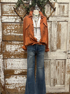 Mannequin wearing a boutique clothing jacket, white shirt, and camouflage pants with handmade jewelry in Leavenworth, KS boutique
