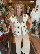 Lu wearing a sunflower-patterned vest in a store setting