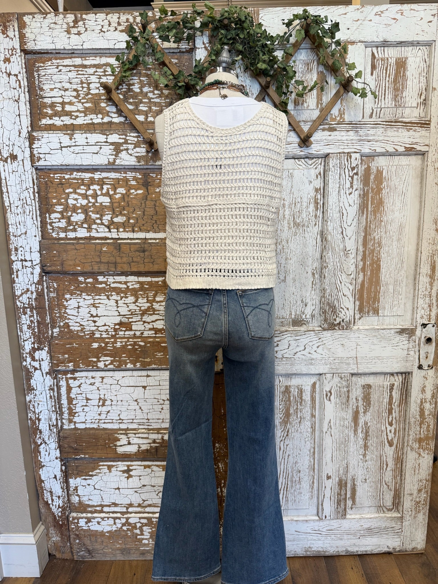 Mannequin in Leavenworth boutique store in leisurewear pants and crochet vest with handmade jewelry 