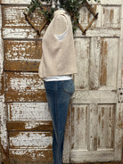 Mannequin wearing a boutique clothing vest white shirt and pants with handmade jewelry in Leavenworth, KS boutique