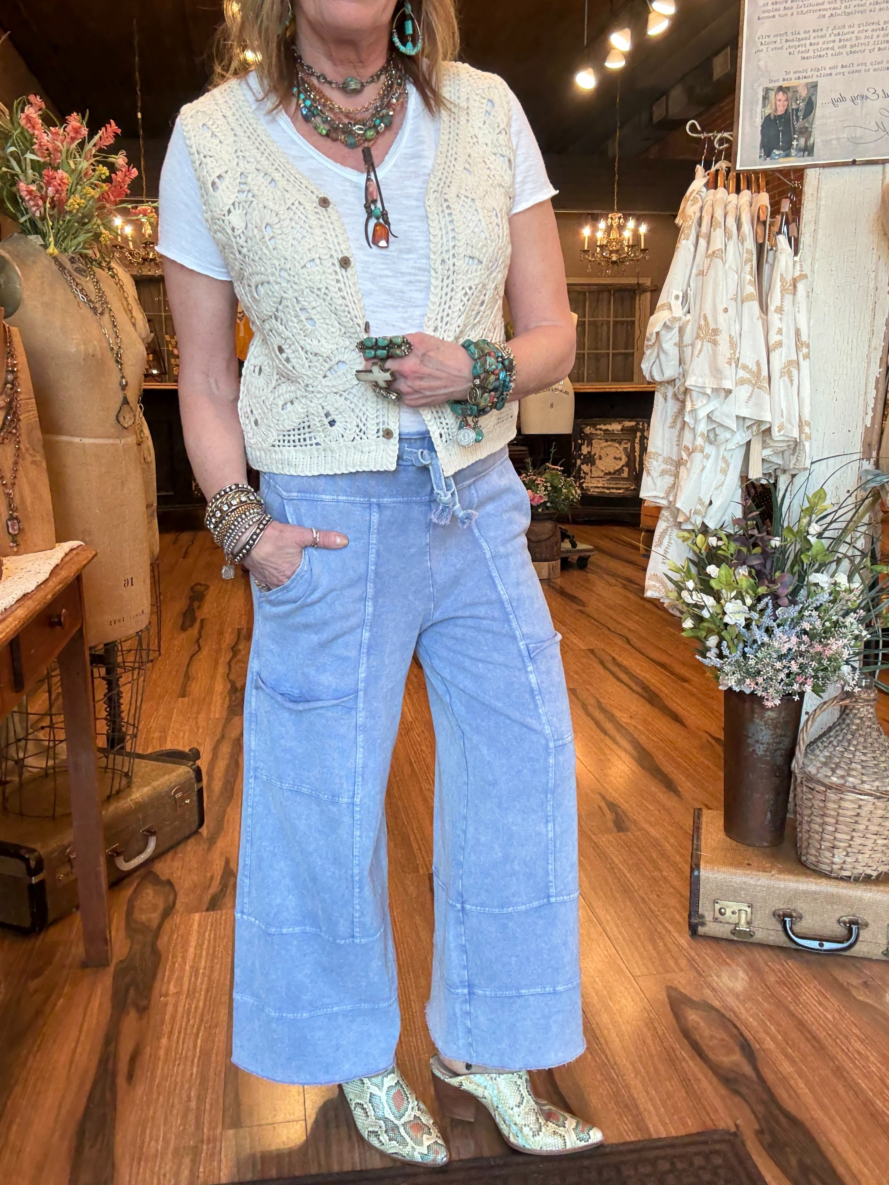 Lu wearing leisure pants - comfortable loungewear and leisurewear for women with handmade jewelry and crochet vest in Springfield MO boutique 