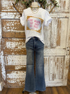 Mannequin wearing graphic tee and jeans 