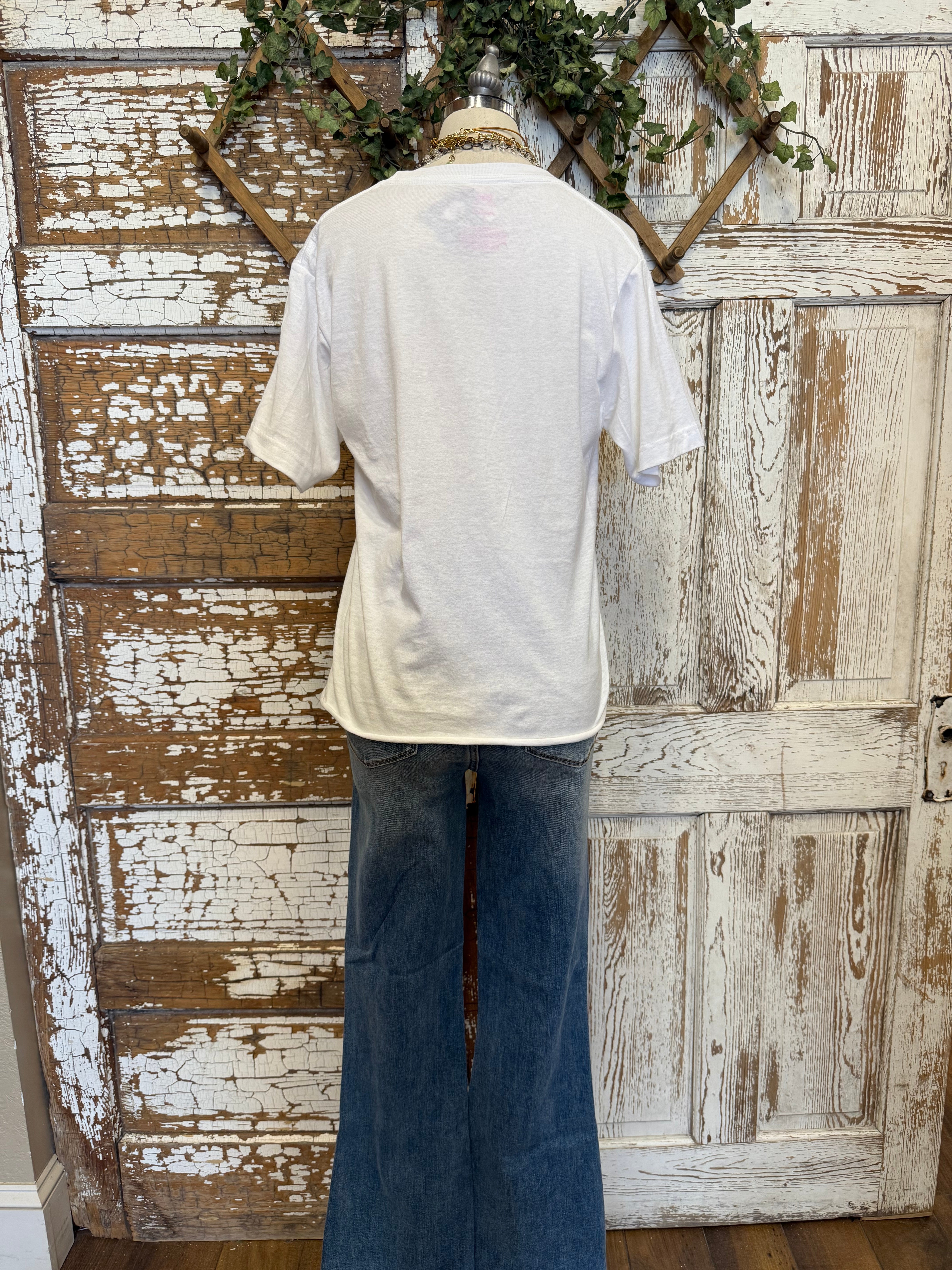Mannequin wearing graphic tee and jeans 