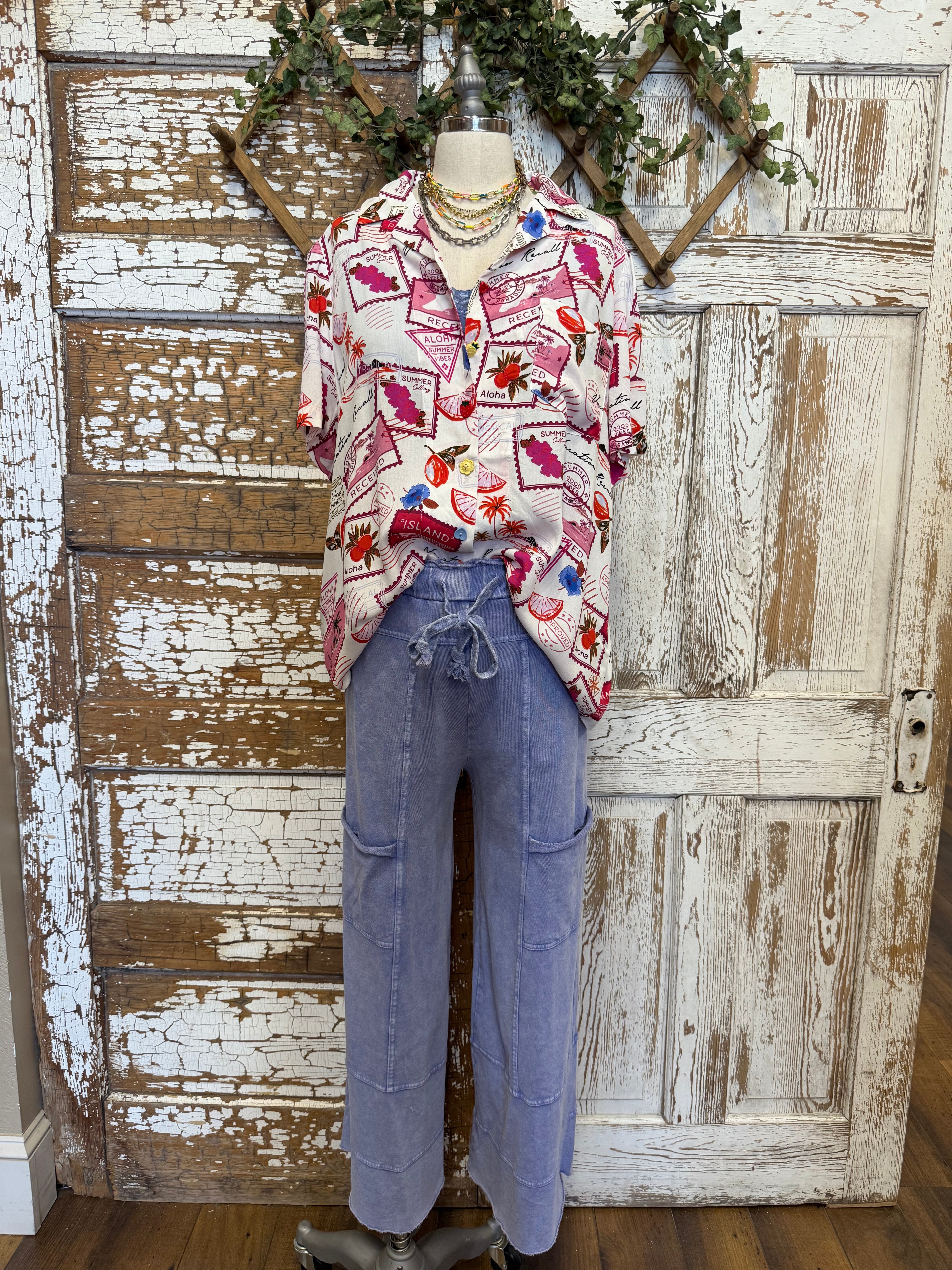 Mannequin wearing a patterned resort shirt with comfortable loungewear pants in boutique 