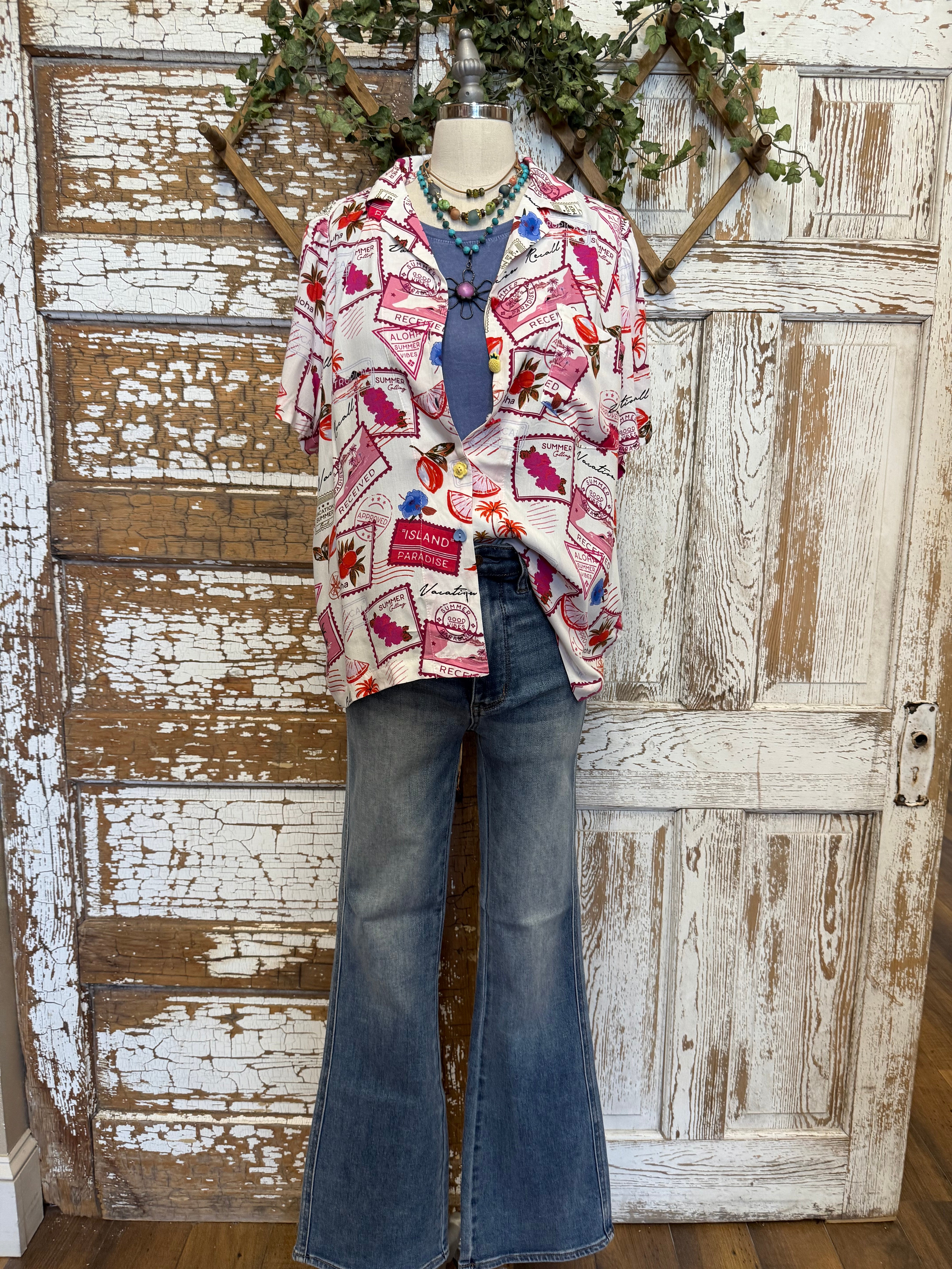Mannequin wearing a patterned resort shirt in boutique 