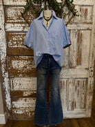 Mannequin wearing a blue striped shirt and dark jeans in Springfield, MO boutique