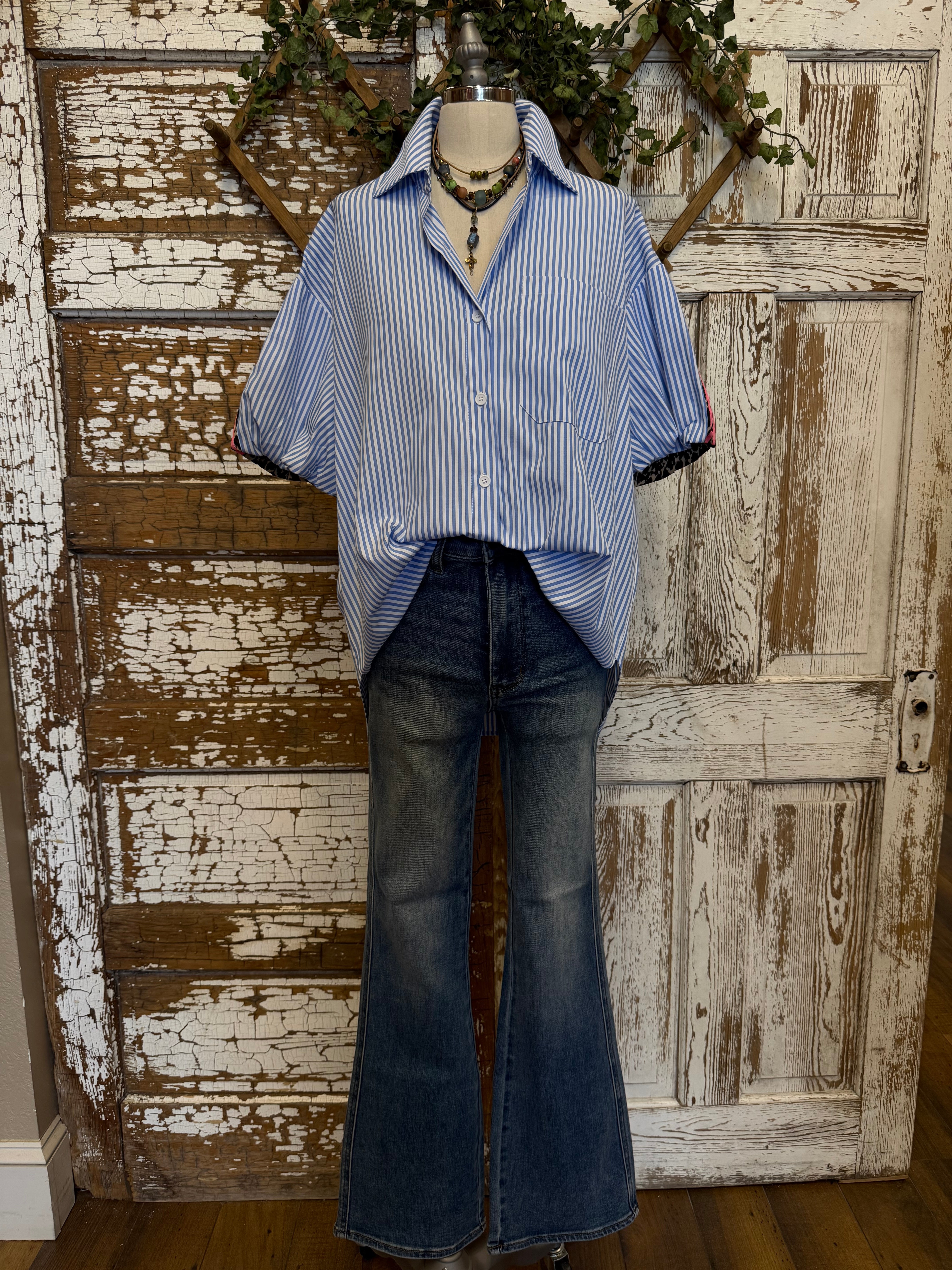 Mannequin wearing a blue striped shirt and dark jeans in Springfield, MO boutique