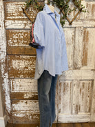 Mannequin wearing a blue striped shirt and dark jeans in Springfield, MO boutique
