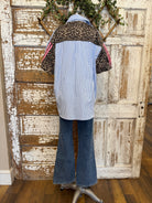 Mannequin wearing a blue striped shirt and dark jeans in Springfield, MO boutique