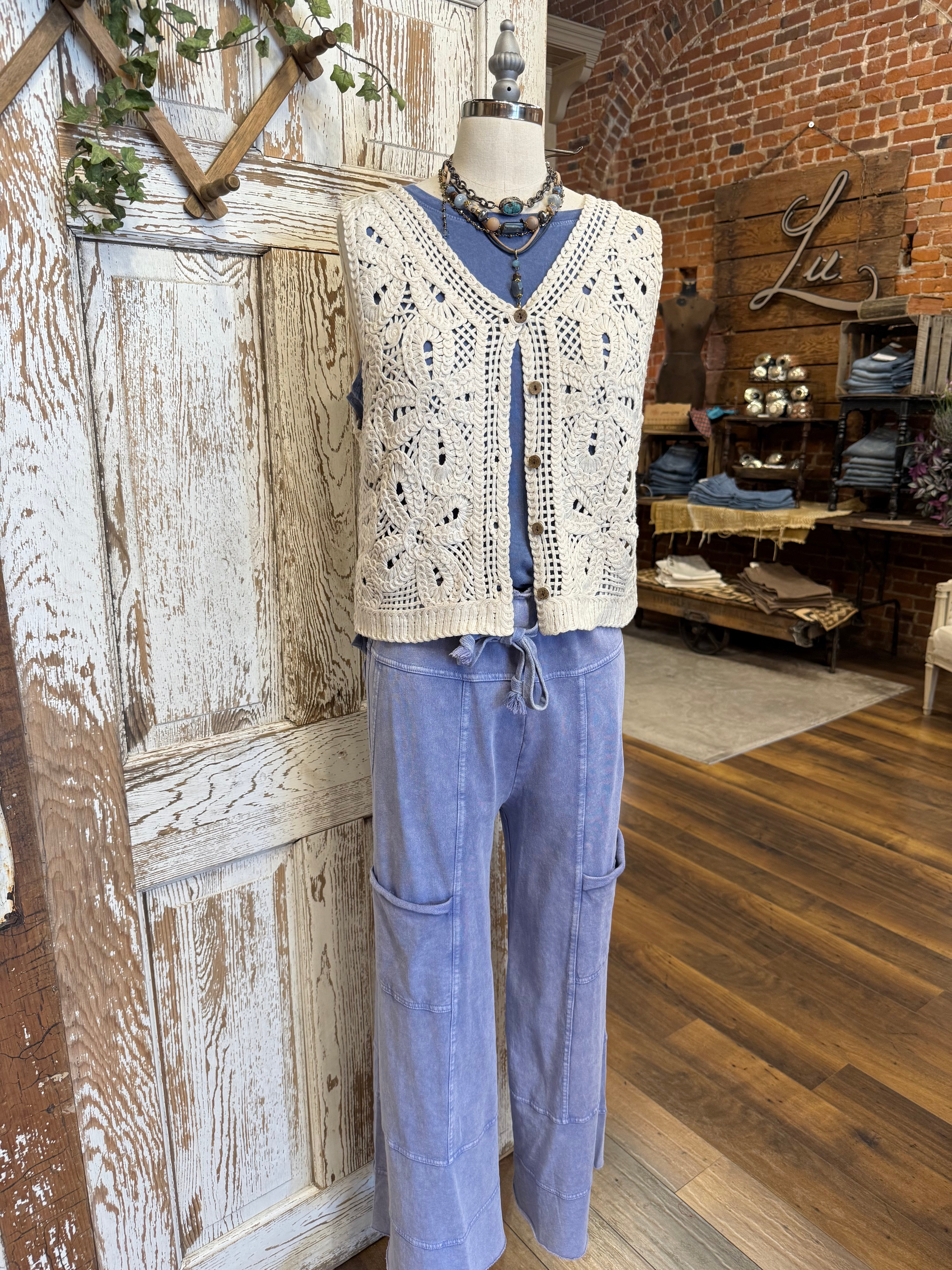 Lu Leisure pants - comfortable loungewear and leisurewear for women with crochet vest in boutique setting 