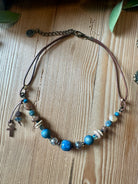 Wanderer's Faith Necklace - leather cord with blue and copper beads and cross charm