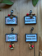 Double-sided soldered glass clip-on charms with Touchdown Kansas City design, red and gold crystal dangles, and football charm in upper and lower dangle styles